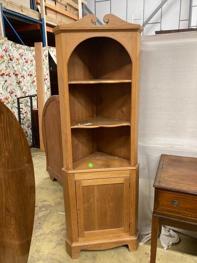 A pine standing corner cabinet, height 180cm